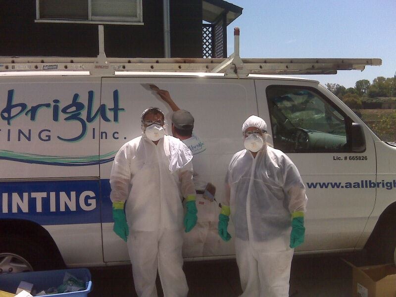 two ALLBRiGHT Employees in front of company van