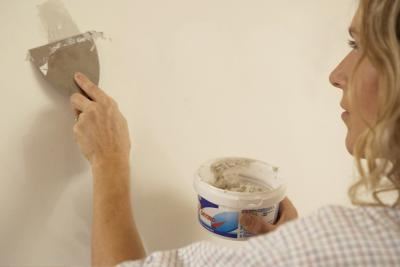 person preparing room to paint