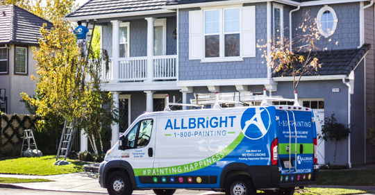 Painting truck outside of house