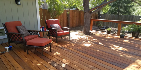 A freshly restained deck with a smooth, protective finish.